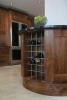 Round Peninsular unit and Fridge Freezer Surround. In Solid Black Walnut.